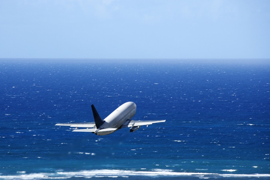 Airplane over ocean