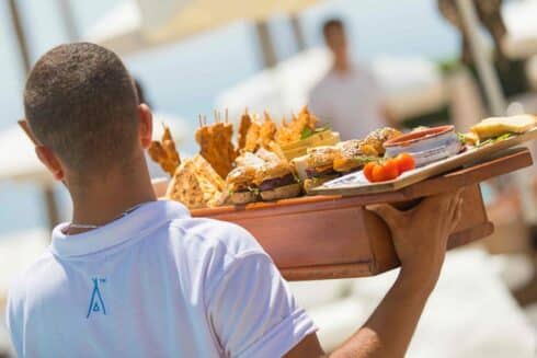 Nikki Beach waiter with food