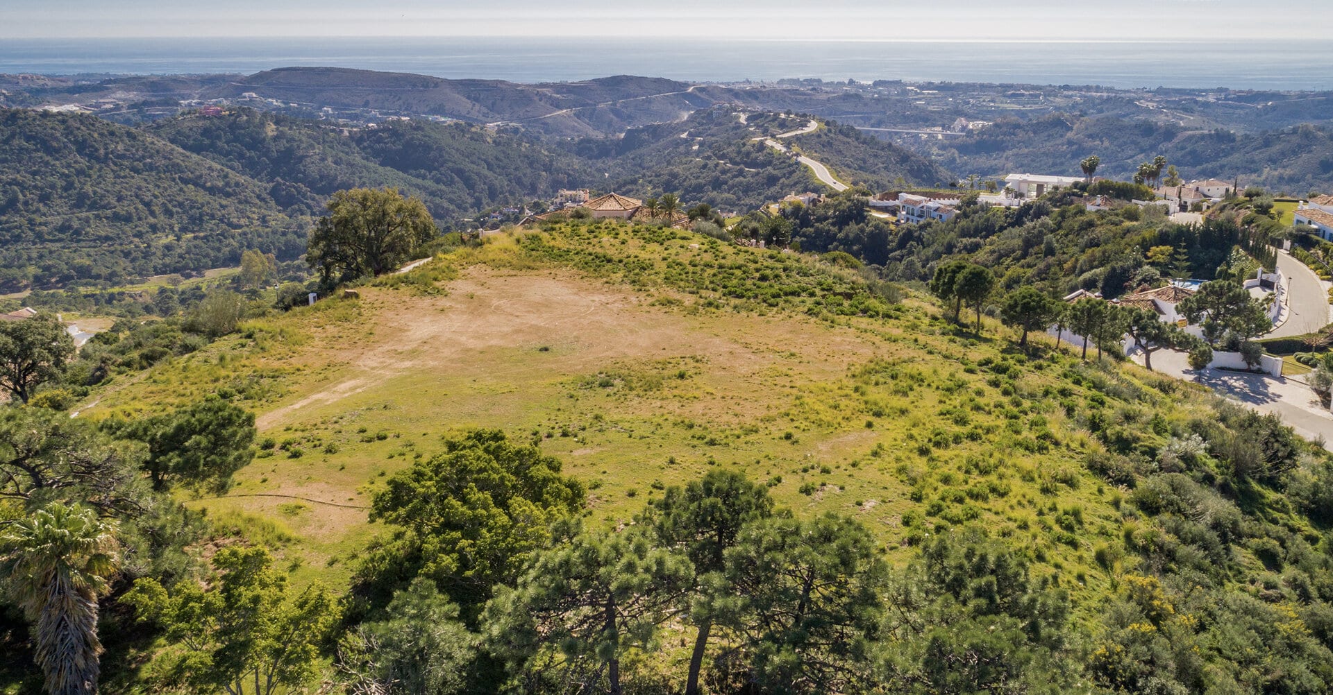 South orientated plot with incredible 360-degree views of the Mediterranean Sea in the secured community of Monte Mayor Benahavis